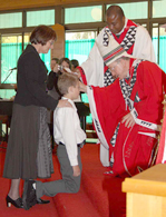 Archbishop Battersby confirming child